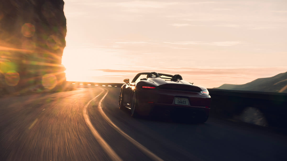 Porsche 718 Spyder carving through a canyon road